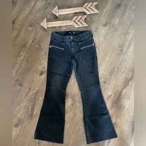 Forever 21 boot cut black jeans. Front pocket zipper accent.